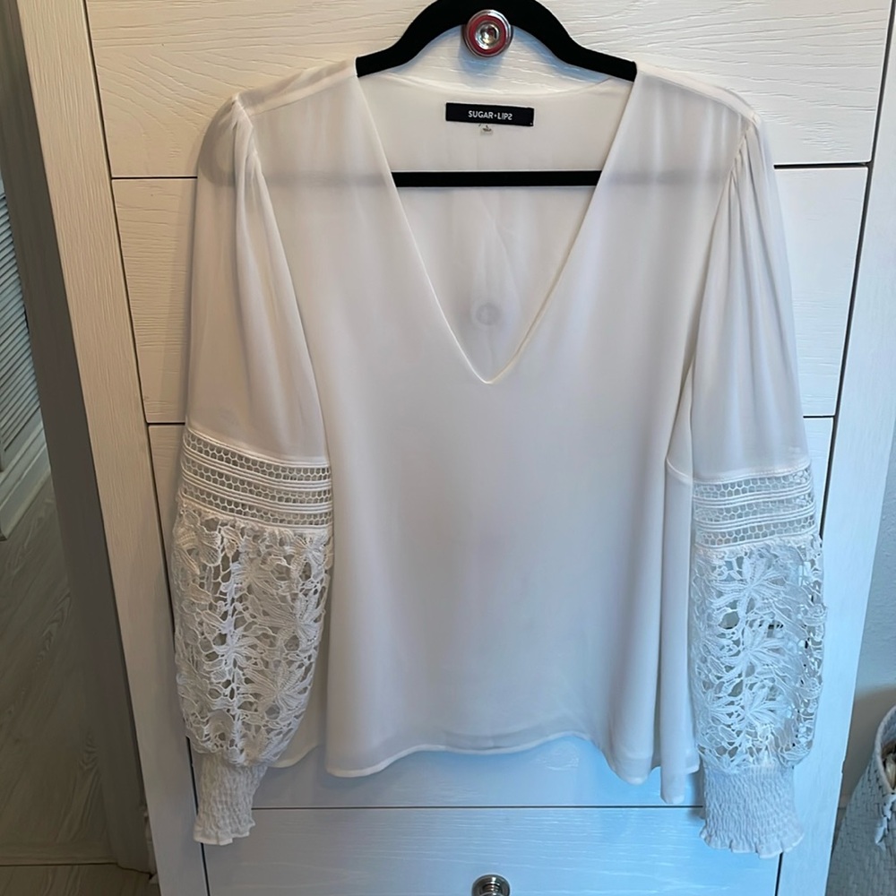 White long sleeve blouse with decorative lace sleeve.   Size L
